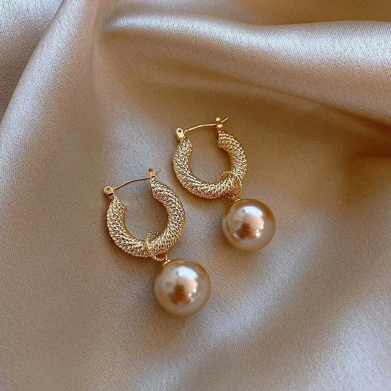 Geometric copper zircon earrings with rose design element in electroplated finish