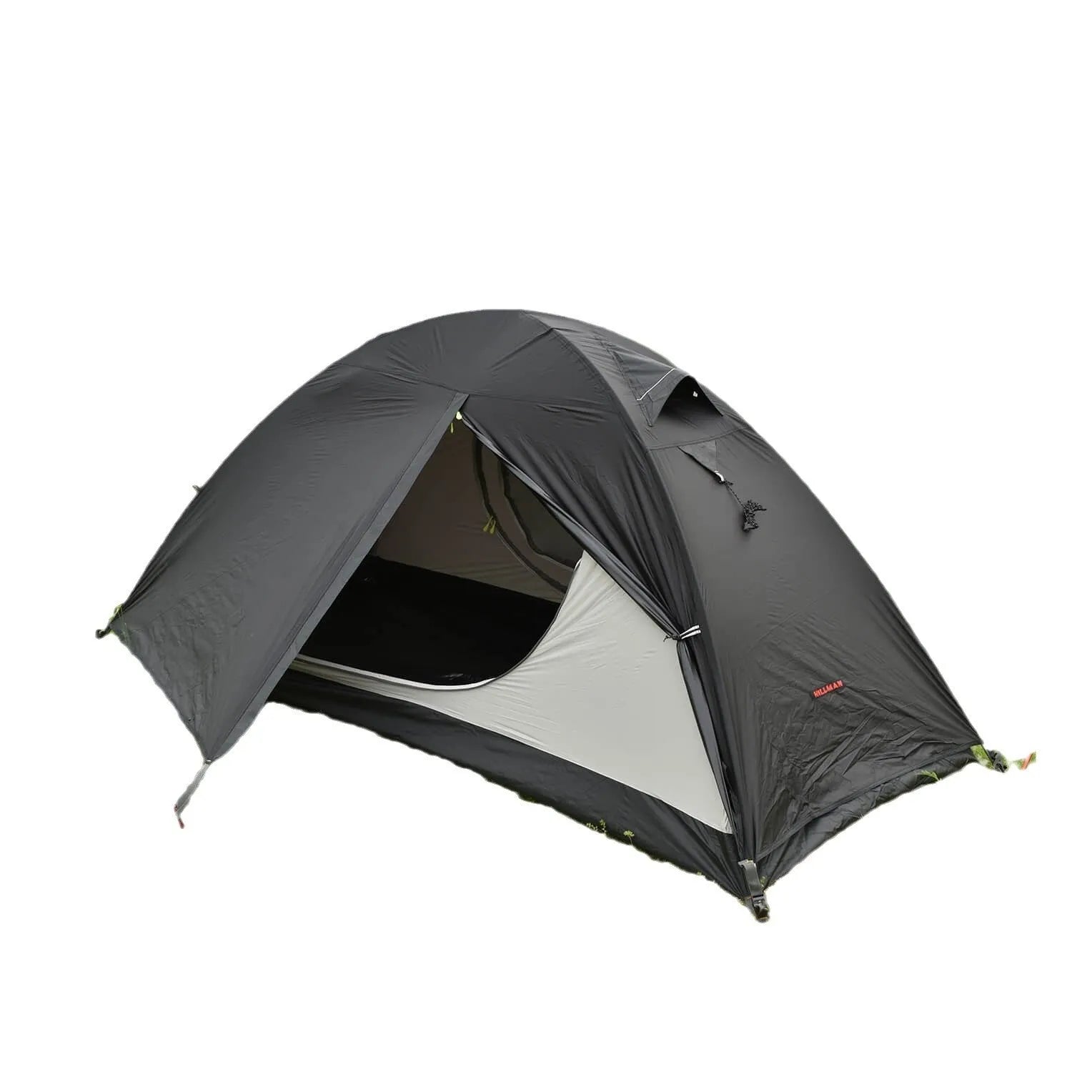 Red single person backpacking tent with aluminium poles pitched in a forest, showing double-layer design and vestibule.