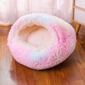 Waterproof cloth dog kennel with semi-surrounded walls and a removable cushion in a champagne colour.