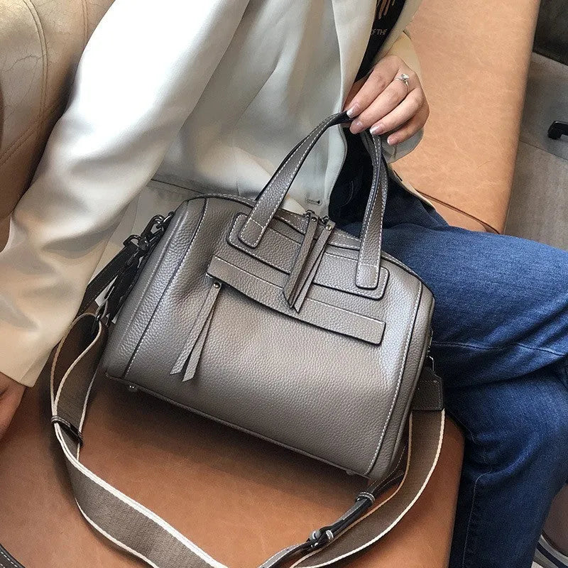 Genuine cowhide leather messenger bag with lychee pattern texture in horizontal square shape showing internal compartments