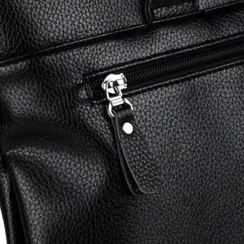 Men's black PU leather shoulder messenger bag with a splicing design detail.