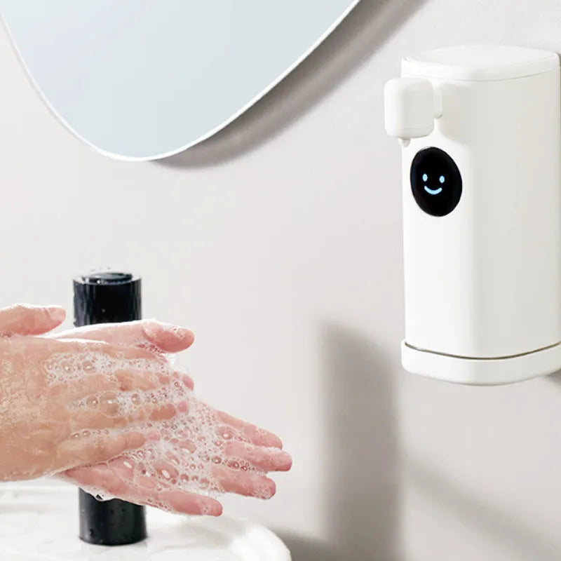 White Smile automatic hand washing machine with intelligent induction sensor mounted on a wall showing foam dispensed into a hand