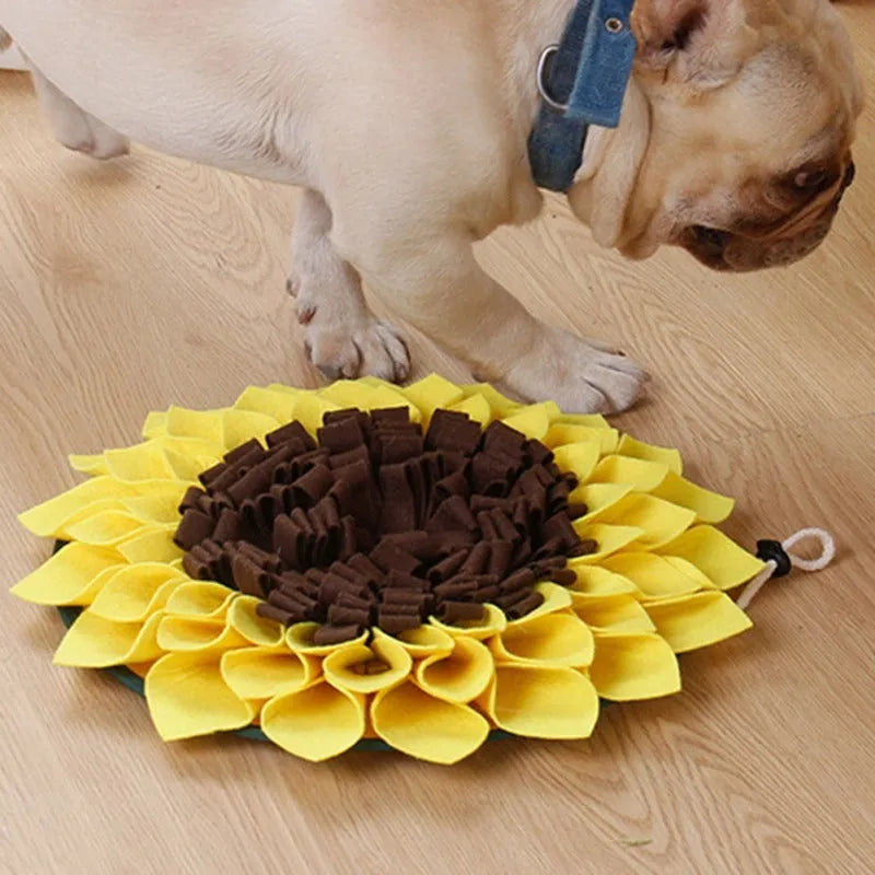 Yellow sunflower-shaped dog snuffle mat with fleece surface and a rope for hanging