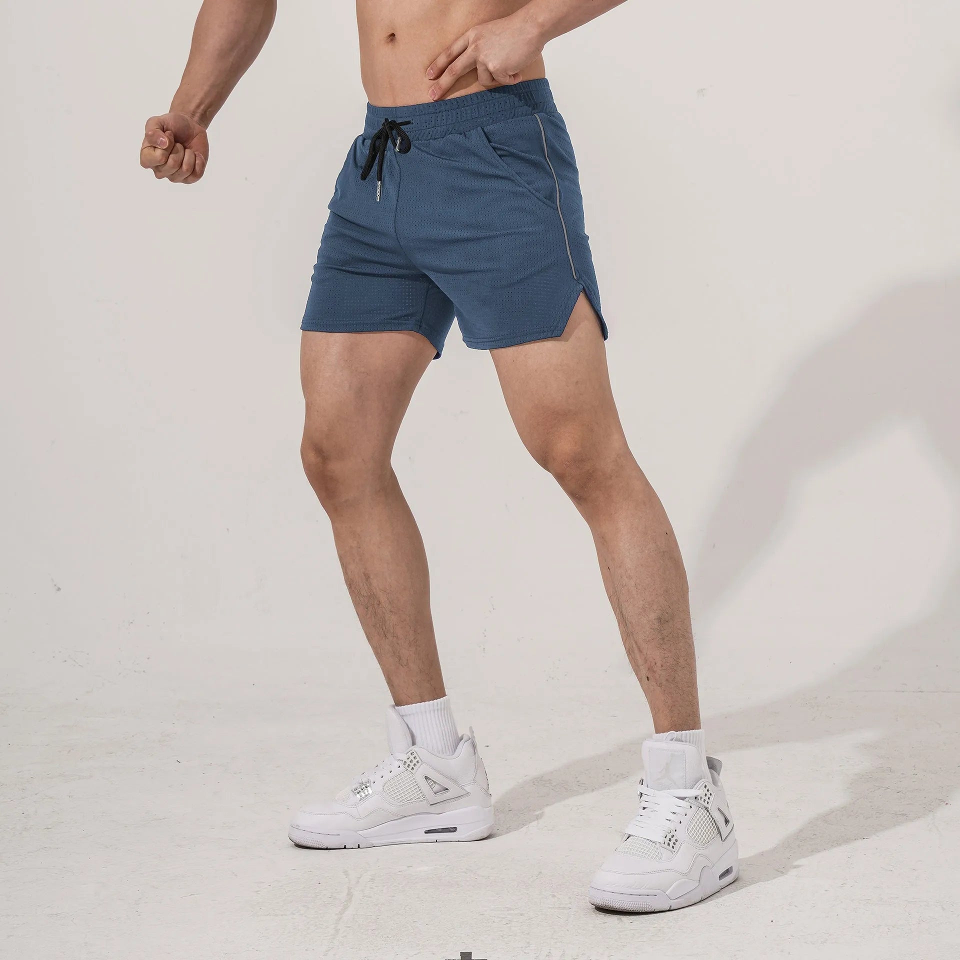 Men's straight-leg sports casual shorts in polyester fabric, shown in black, grey, navy, and red.
