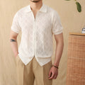 Light brown cotton zip-front cardigan with short sleeves and a lapel collar on a hanger.