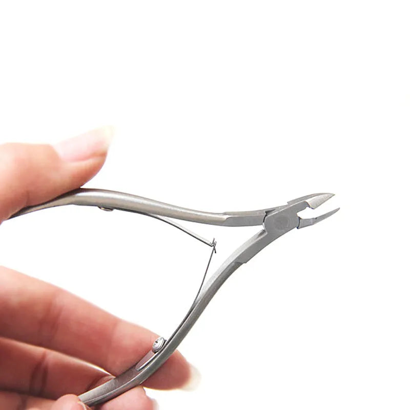 Silver stainless steel nail beauty pliers for manicure and pedicure grooming.