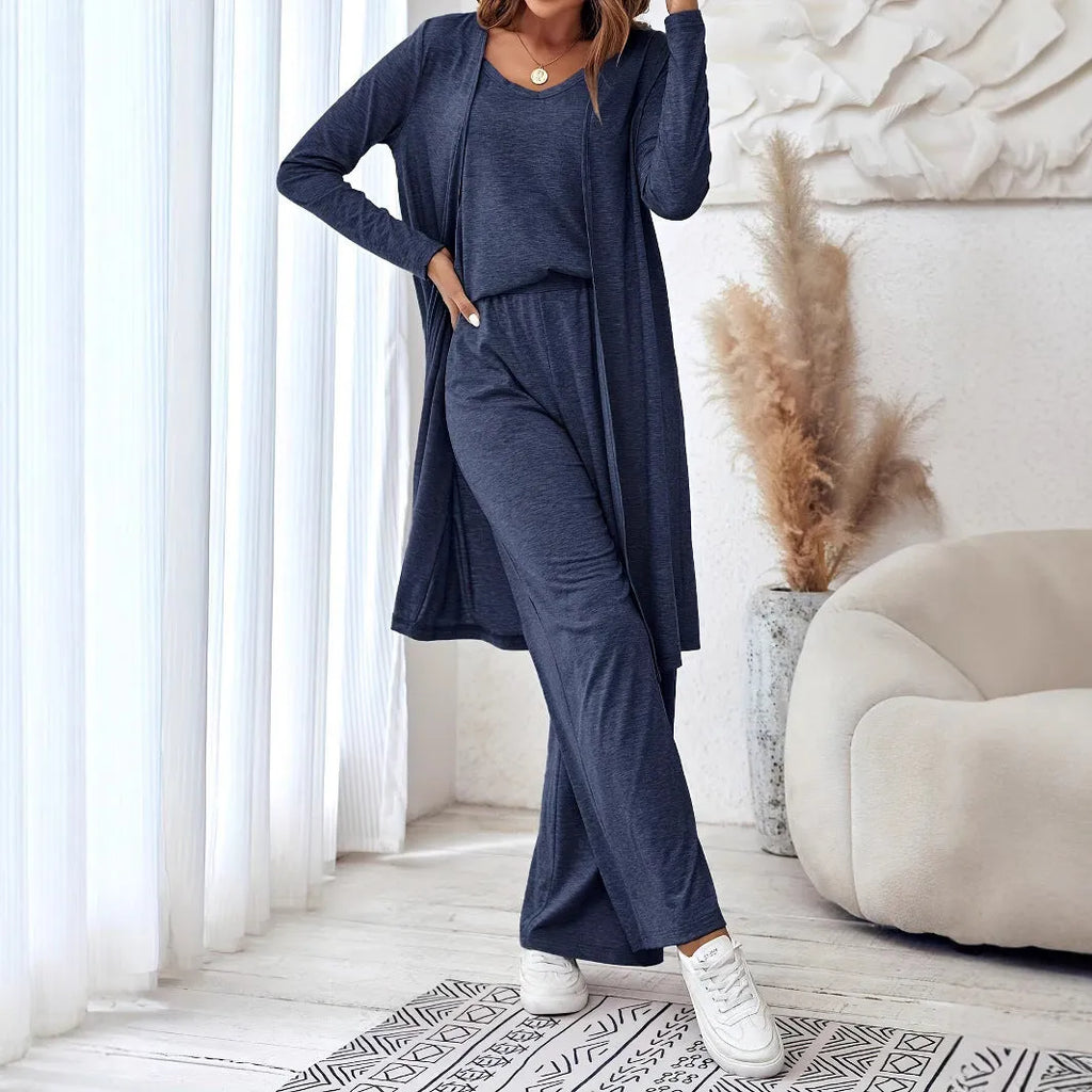 Blue women's three-piece casual suit set with sling top, cardigan, trousers, and suspenders.