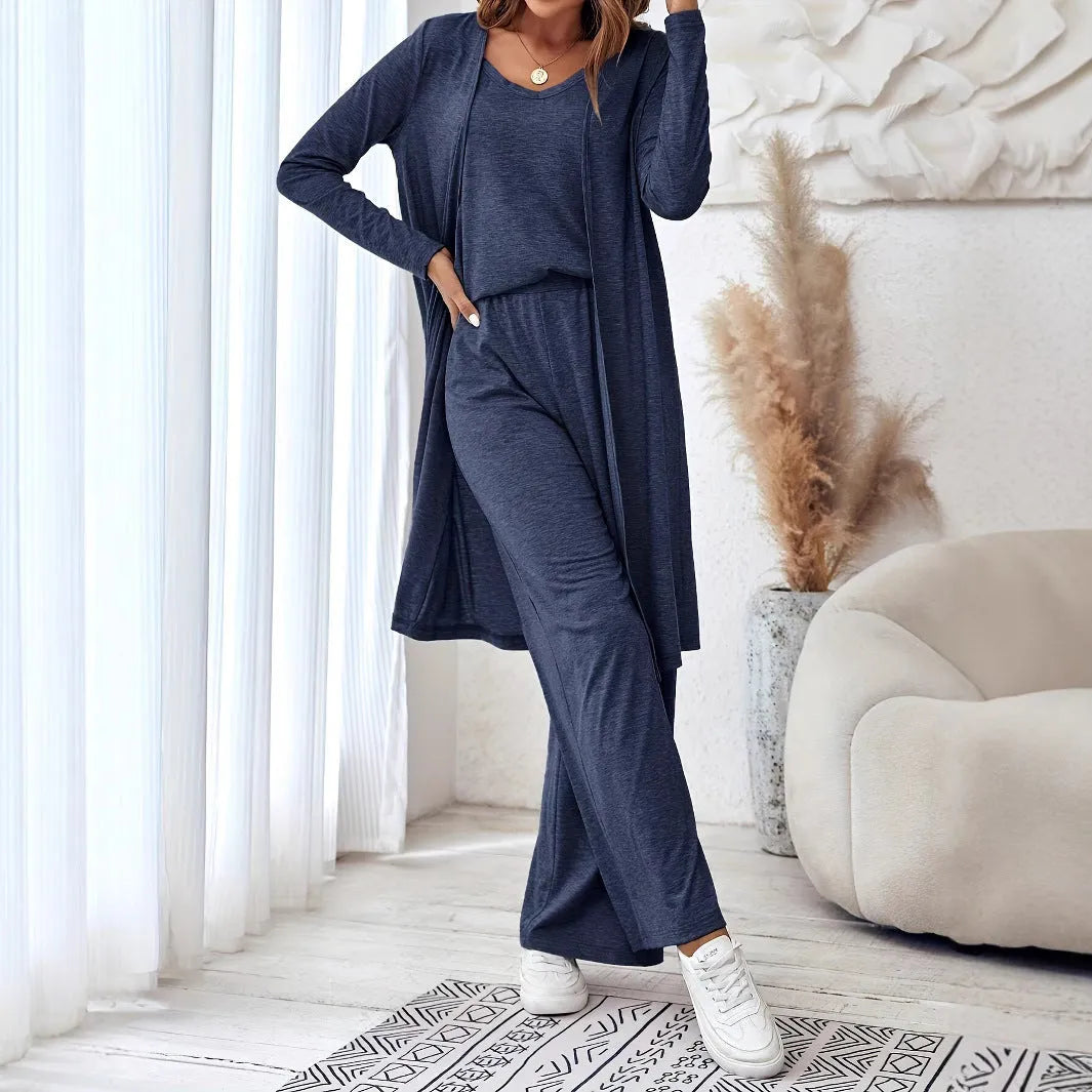 Blue women's three-piece casual suit set with sling top, cardigan, trousers, and suspenders.