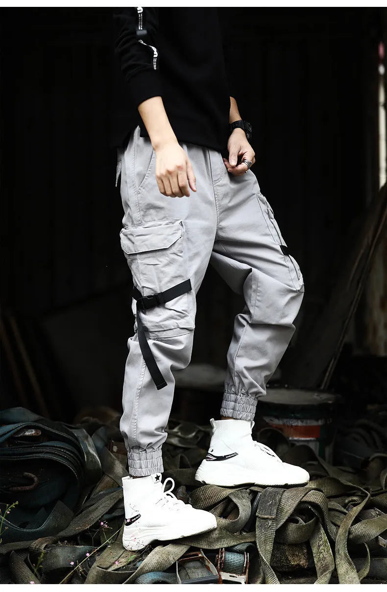 Men's cotton cargo pants in black, grey, and khaki, casual multi-pocket trousers with size chart.