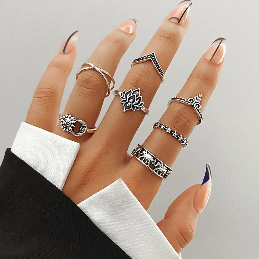 Alloy ring set with butterfly and snake retro geometric designs on display