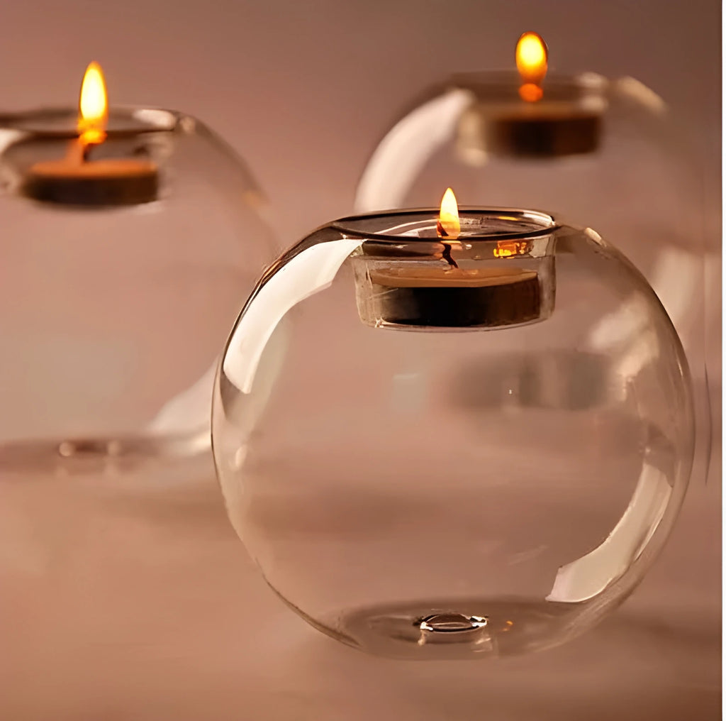 Handmade clear round hollow glass candle holder in European style on a table.