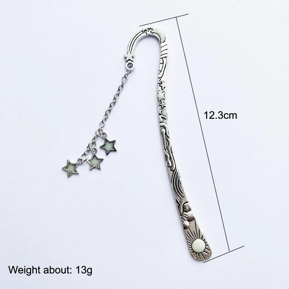 Retro five-pointed star metal bookmark with fluorescent detail in ancient silver or bronze celestial design