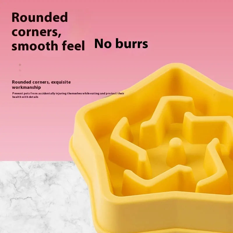 Yellow plastic slow feeding dog bowl with raised pet pattern at bottom