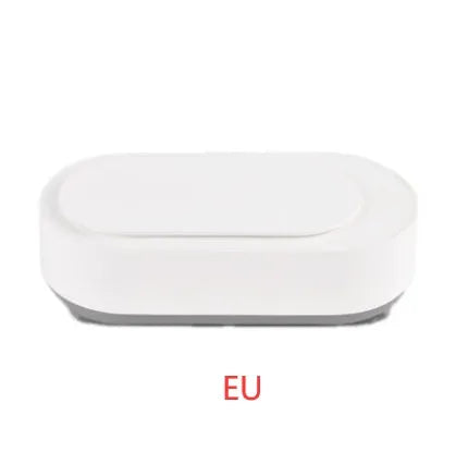 White portable ultrasonic cleaner with stainless steel tank and a single control button.