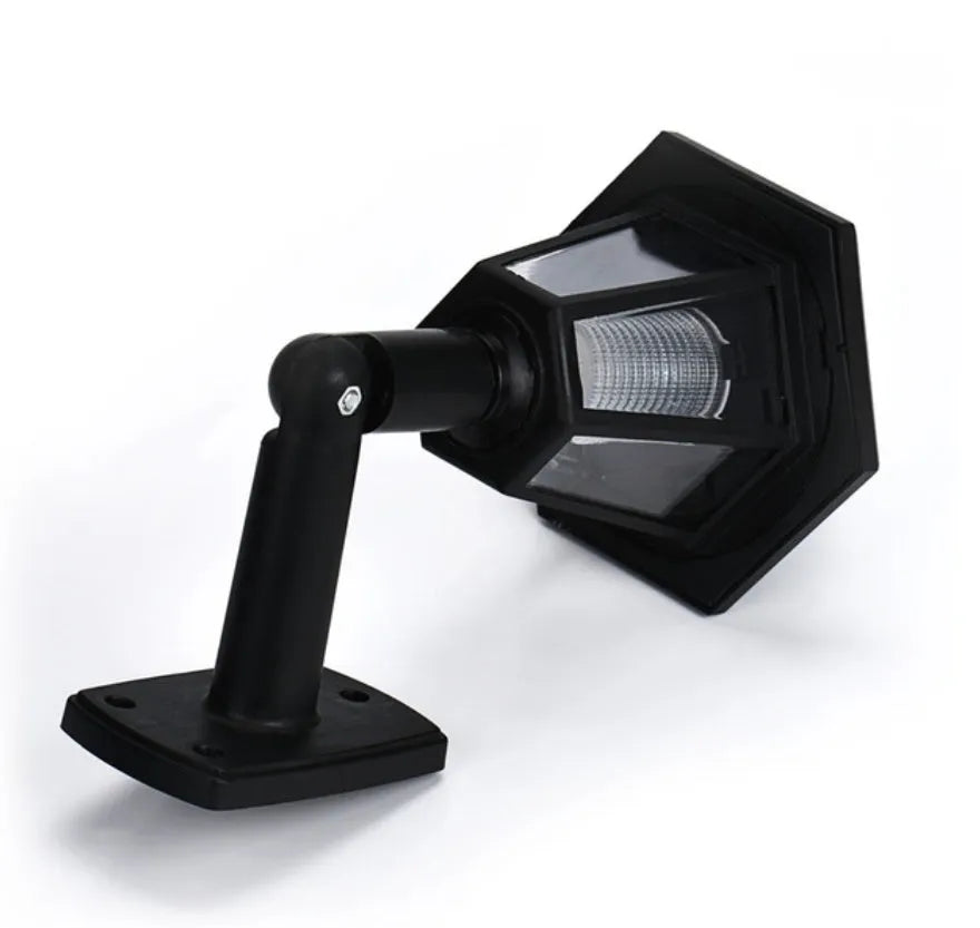 Black hexagonal solar-powered wall light with integrated solar panel and waterproof IP44 rating for outdoor use