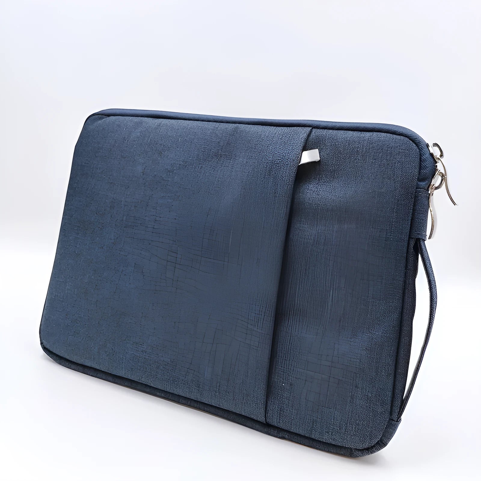 Grey canvas protective sleeve case for an iPad Pro 12.9 tablet on a wooden table.