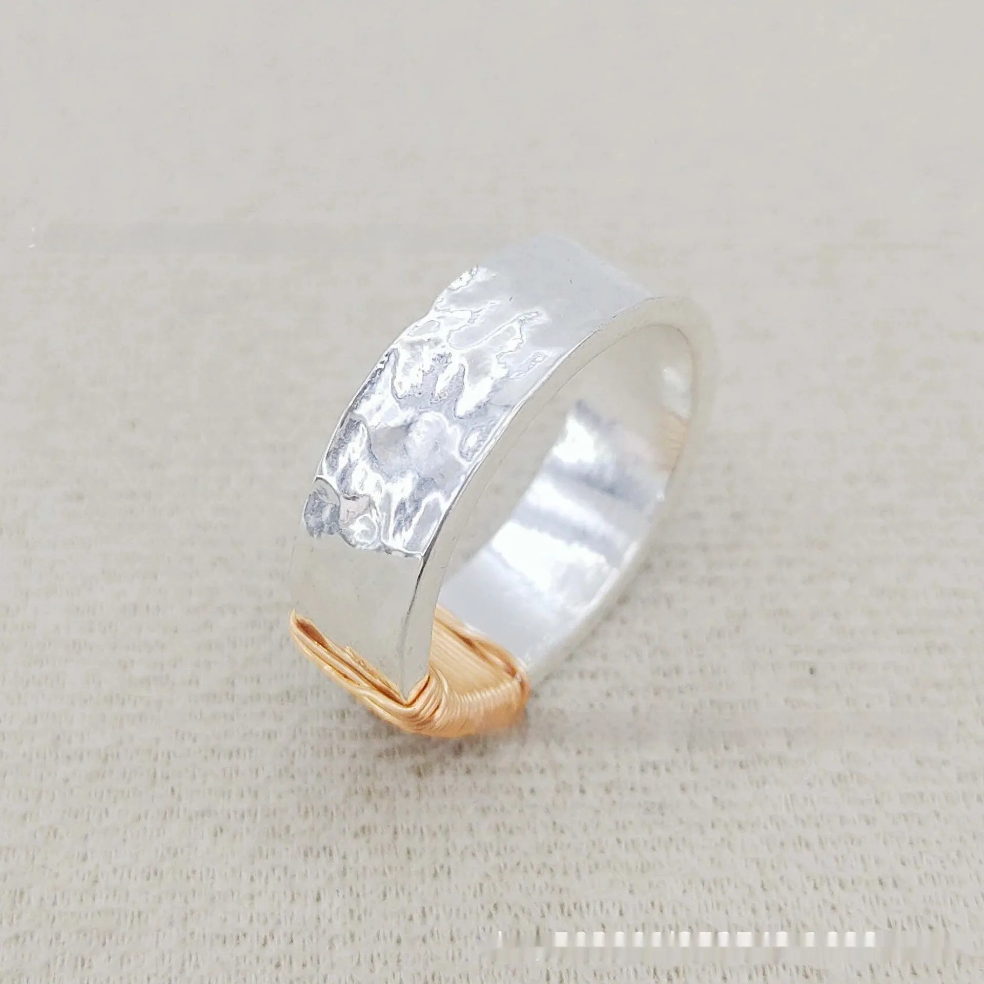 Copper geometric wide ring bracelet with irregular coil design in silver-gold colour.