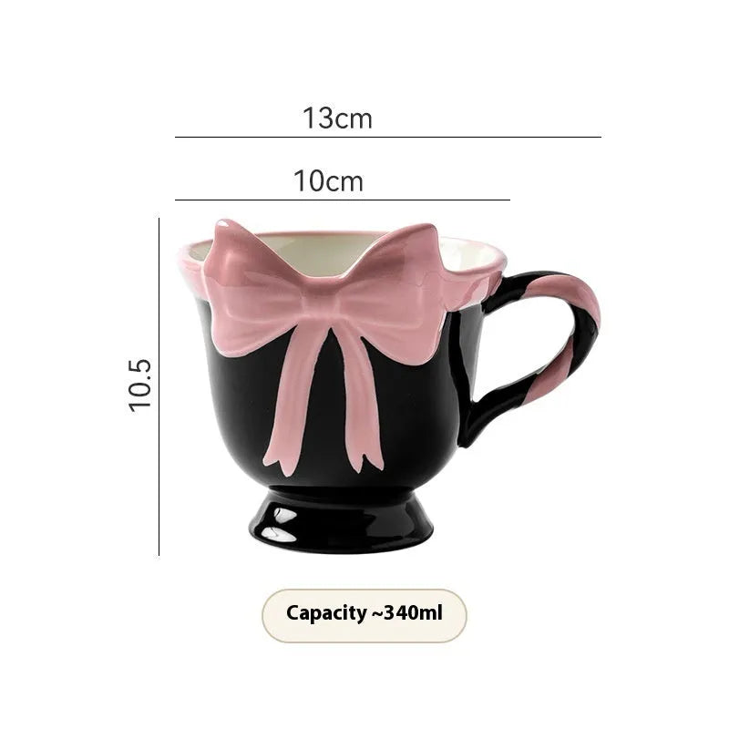 Ceramic mug with a cute girl heart bow design in white powder and black pink colours.