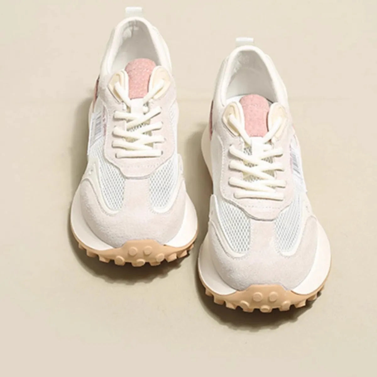 Women's grey and pink retro sneaker with low-top design and flat rubber sole