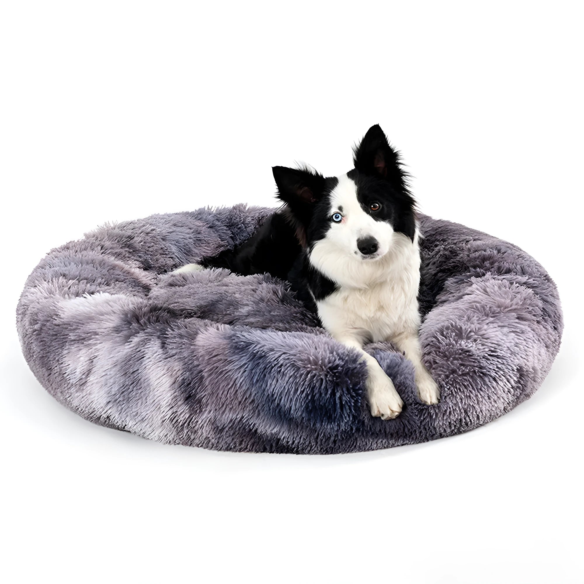 A fluffy, round donut-shaped dog bed with a raised rim in long plush fabric.