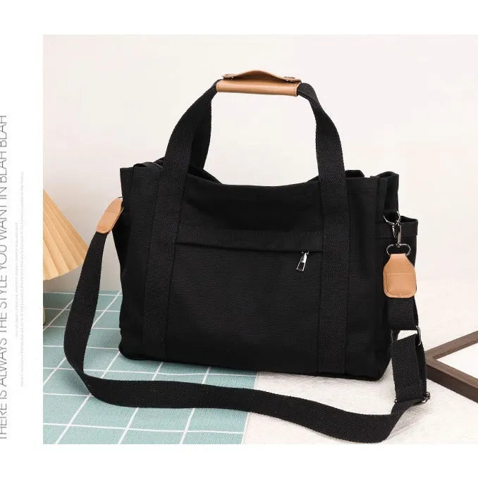Large canvas tote bag with internal organisation pockets in neutral colour