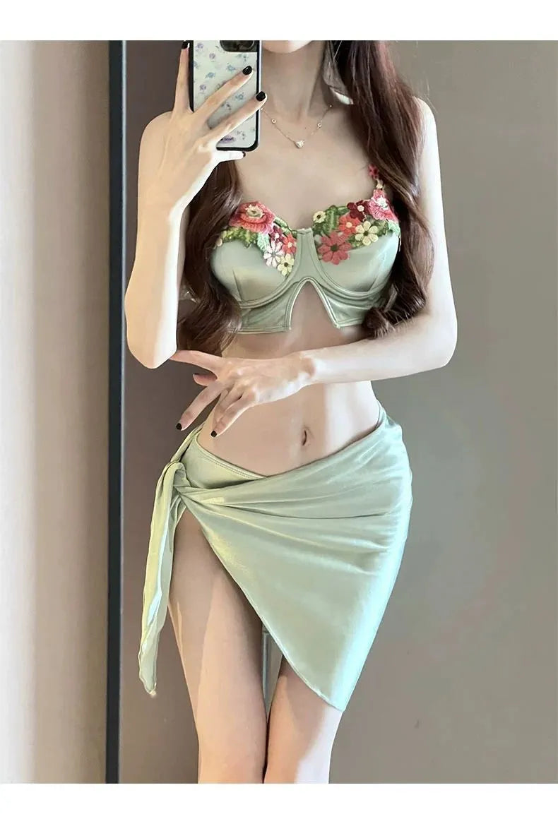 Green women's triangle bikini three-piece set with skirt on Asian size mannequin