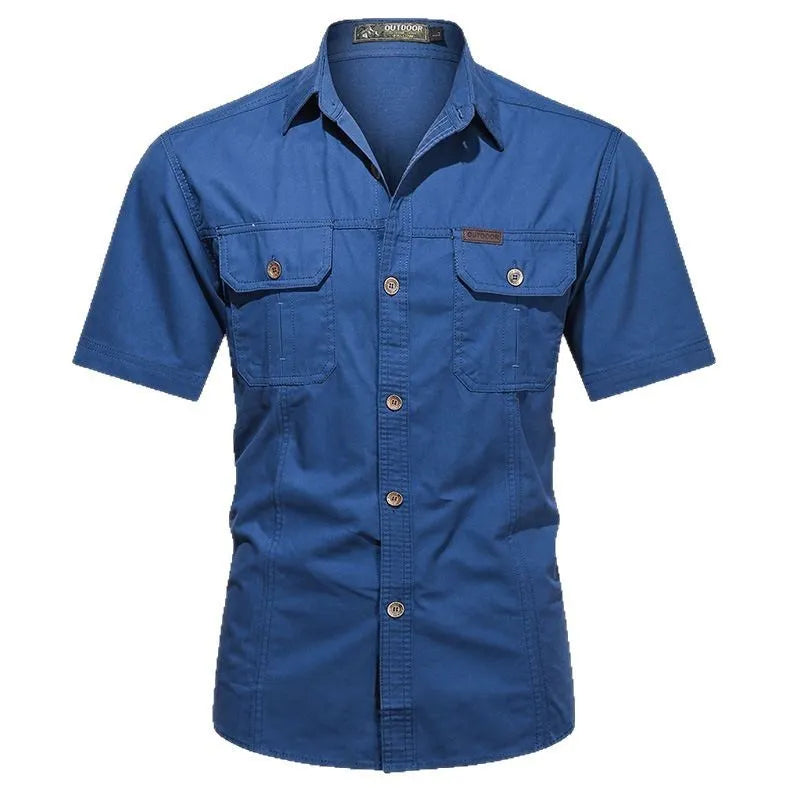 Man wearing a loose-fitting short sleeve cotton work shirt in a cardigan style.