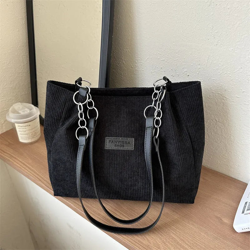 Corduroy one-shoulder tote handbag in black, brown, or white with horizontal square silhouette