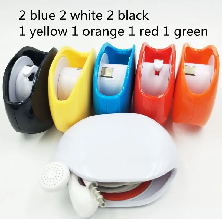 Automatic earphone cable winder retractor in blue, showing compact size next to a 3.5mm jack.