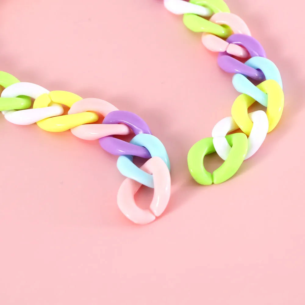 Adjustable plastic pet collar in candy chain blue colour on a white background, showing the monochrome pattern.