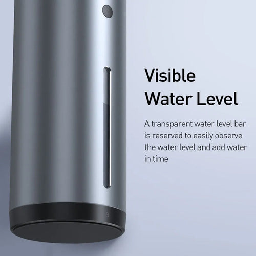 Black aluminium alloy car diffuser humidifier with USB cable on a desk.
