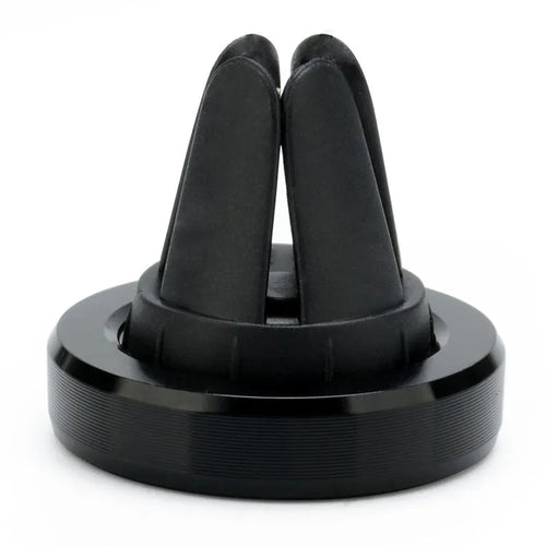 Magnetic car phone holder mounted on air vent with mobile phone attached
