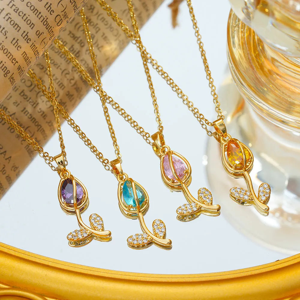 Gold-toned tulip flower zircon pendant on an adjustable O-ring chain necklace for women.