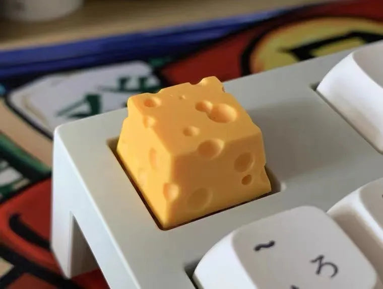Yellow resin cheese keycap for mechanical keyboards with 3D design detail