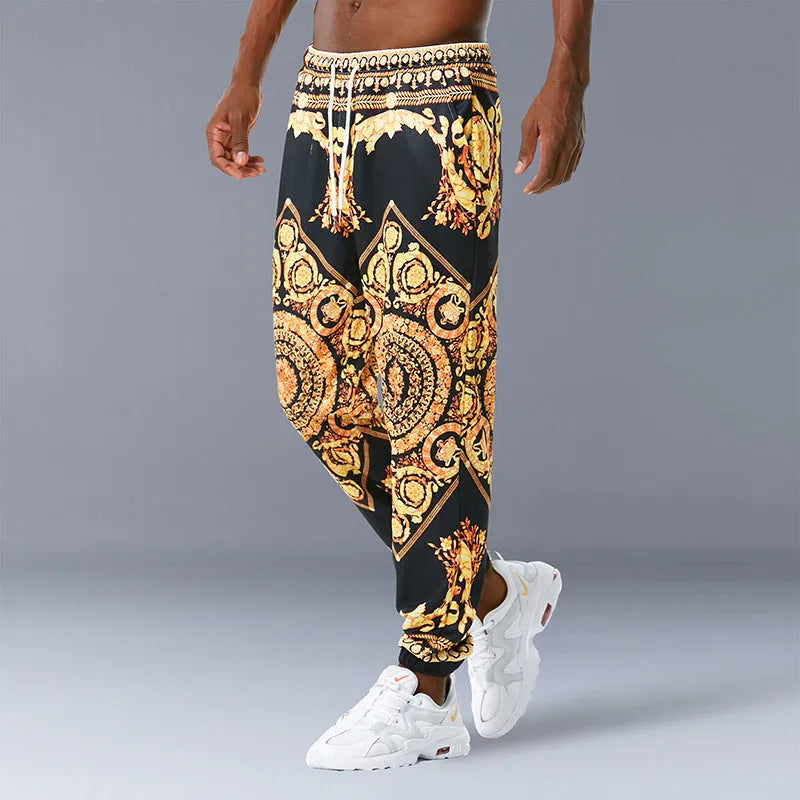 Printed jogging pants in loose fit with drawstring waist, small leg opening, and ribbed hem, available in multiple colours