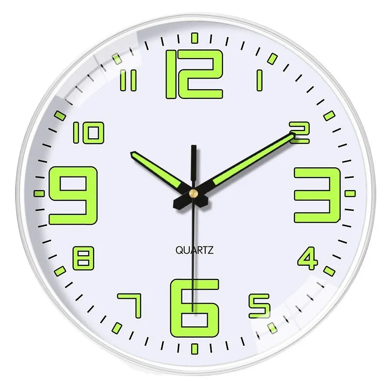 Modern 8 inch circular wall clock with luminous numerals on a white wall