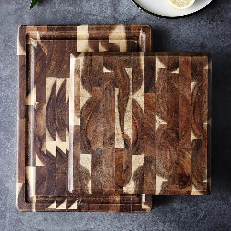 Brown parquet-pattern solid wood chopping board with 3cm thickness on a kitchen counter.
