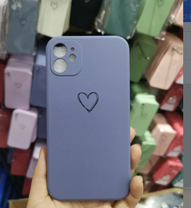 A solid colour silicone phone case for Apple iPhone on a table, showing its slim TPU back cover design.