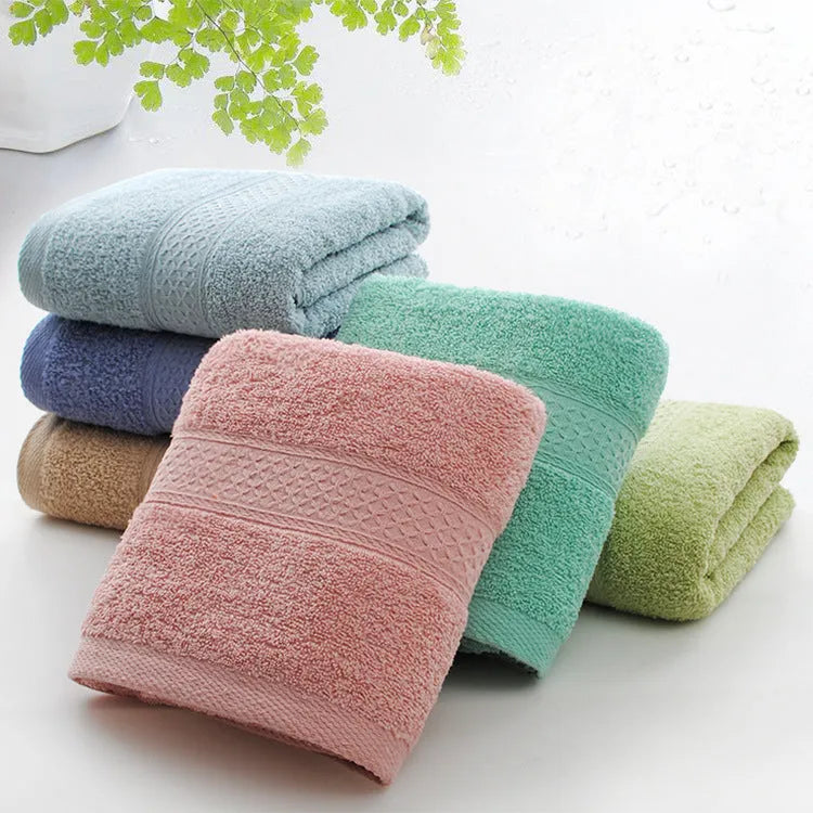 Thickened cotton blend bath and beach towel showing colour options including green, blue and brown variations