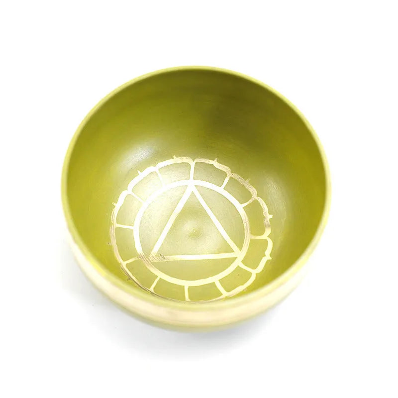 Seven colourful handmade Himalayan-style bowl percussion instruments arranged by size and colour