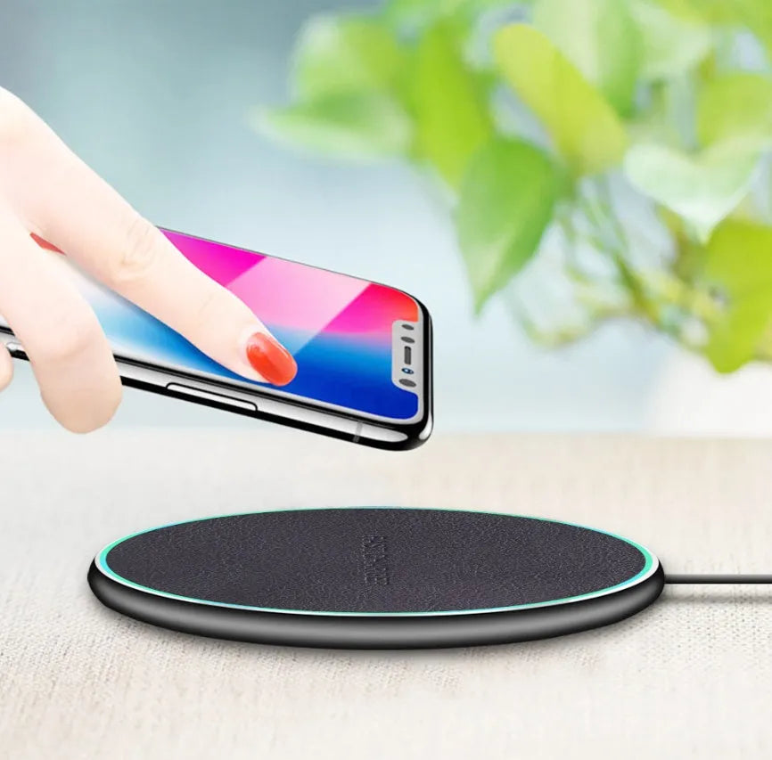 Black Qi wireless charging pad with magnetic phone case holder for Phone 11