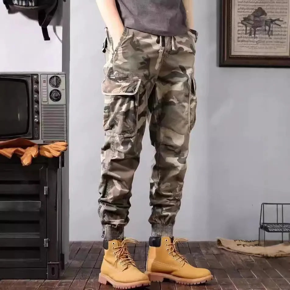 Men's camouflage cargo pants in Army Green, loose tapered fit with pockets, polyester cotton.
