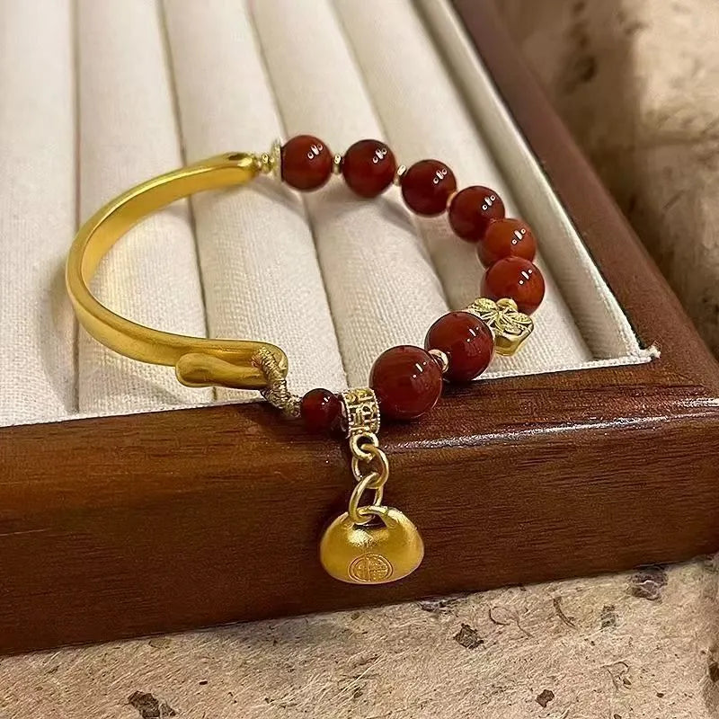 Golden South Red agate lucky bag bracelet with character ingot design for women