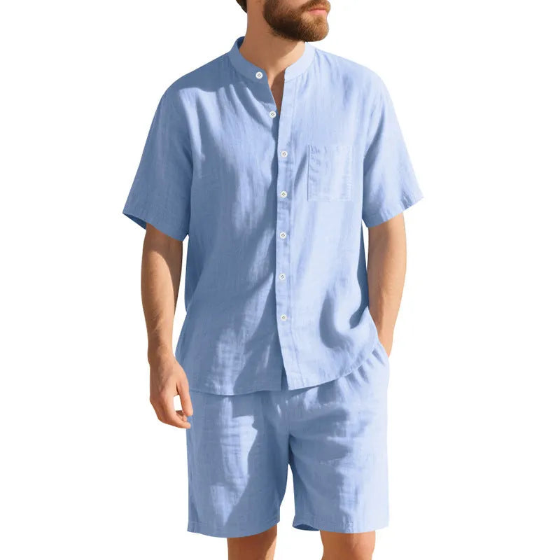 Men's light blue linen blend summer suit with henry collar shirt and shorts on a hanger.