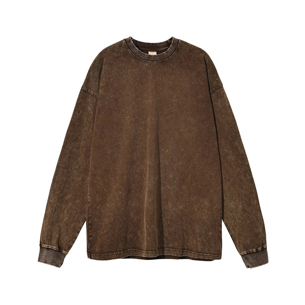 Man wearing a vintage washed batik colour cotton long sleeve pullover in a loose fit.