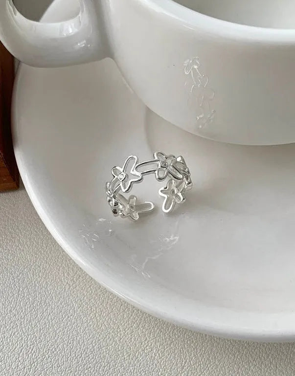 S925 sterling silver irregular hollow-out flower ring with adjustable opening in silver colour