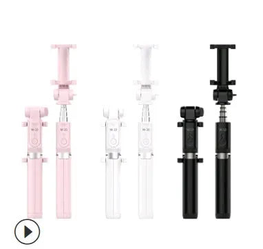 Black Bluetooth selfie stick with extended tripod legs holding a smartphone