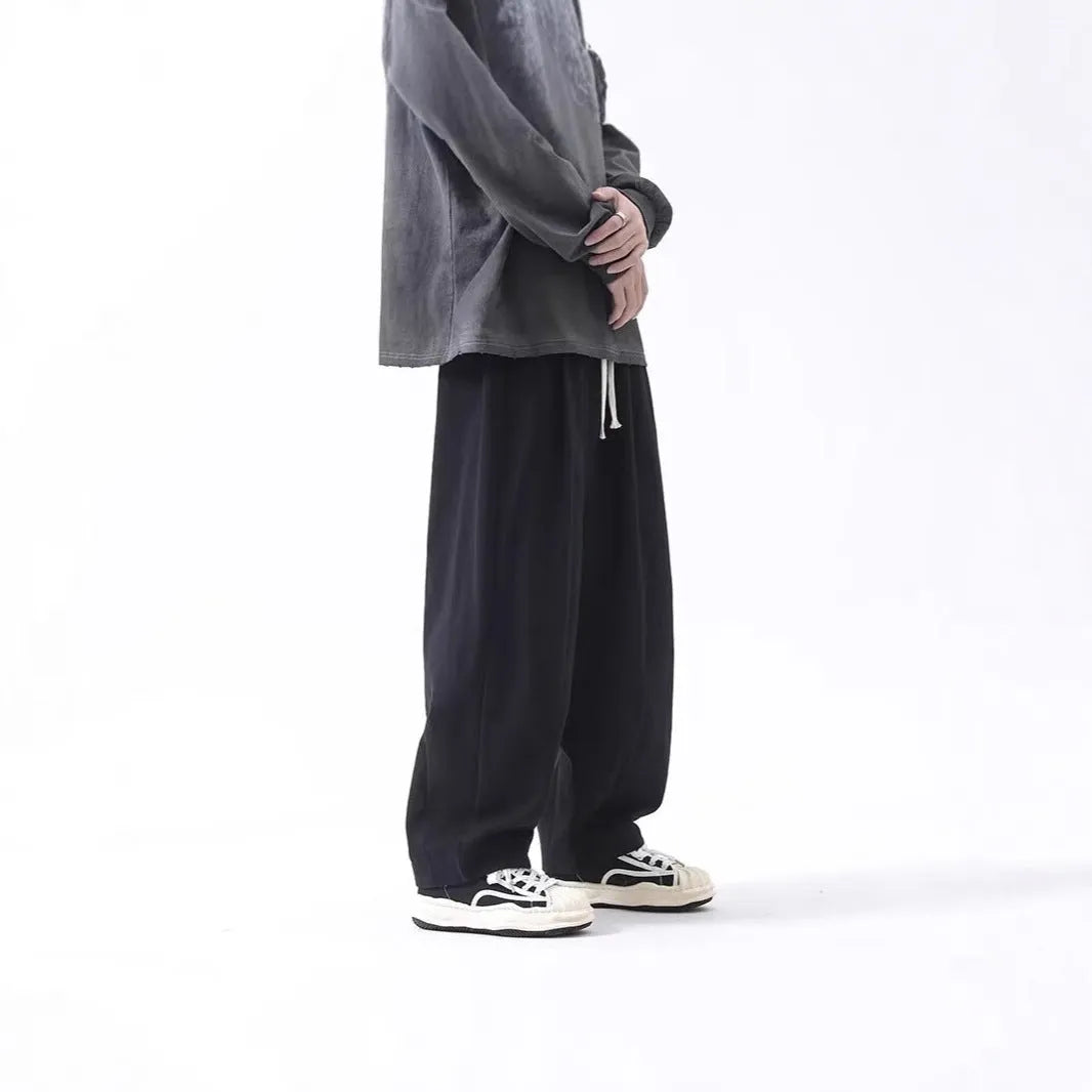 Cotton men's loose wide leg drawstring trousers in black and brown straight leg style with mid waist
