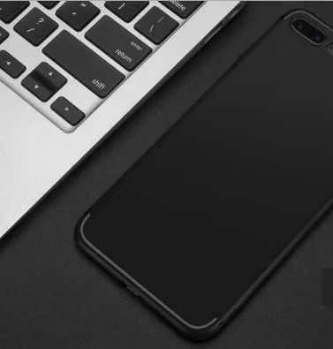 Black TPU silicone protective case fitted on an iPhone, showing precise cutouts for camera and ports.