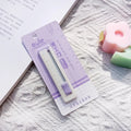 Small plastic-blade art knife in blue, pink, purple, orange, and khaki colours.
